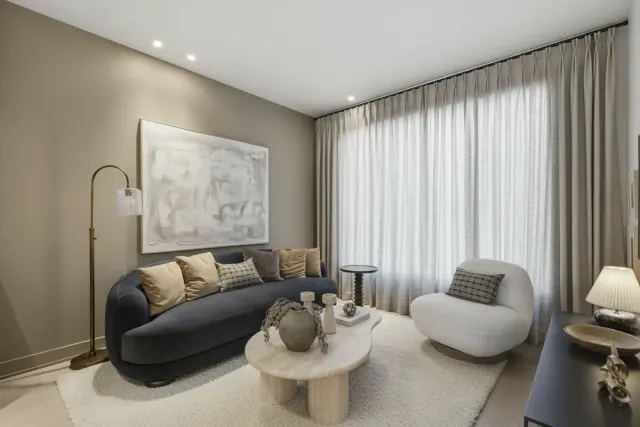 The same living room, renovated in a Contemporary Luxury style